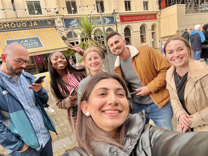 Six people smiling at the camera during a treasure hunt