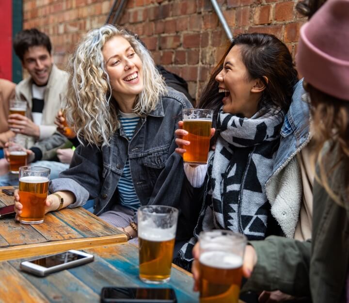 Friends enjoying a drink together while playing Treasure Hunt York