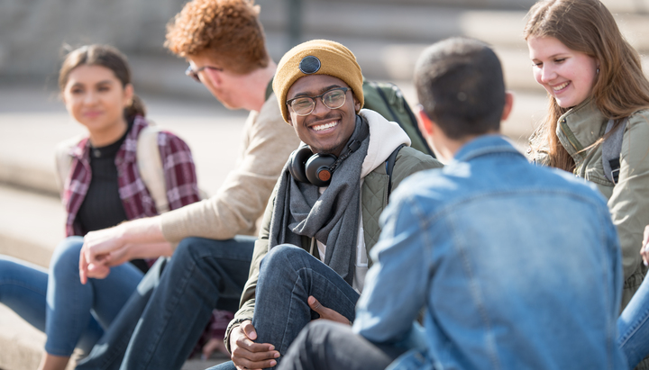 Students sat on steps outside university getting ready to play Treasure Hunt York